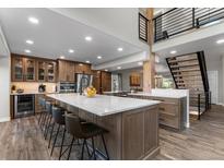 Kitchen island with barstool seating and stainless appliances at 24005 High Meadow Dr, Golden, CO 80401