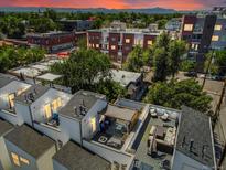 Stunning rooftop patio with lounge seating, dining area, and mountain views; perfect for entertaining at 2833 W 25Th Ave # 5, Denver, CO 80211