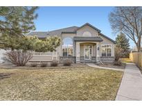 Charming home with well-manicured lawn and welcoming front porch, perfect for relaxing outdoors at 9742 E Hawaii Pl, Aurora, CO 80247