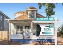 Charming home with a welcoming porch and a sign advertising a discounted rate at 2426 S Acoma St, Denver, CO 80223