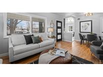 Comfortable living area with a seamless flow into the dining space at 3285 S Emerson St, Englewood, CO 80113