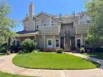 Inviting townhome exterior with a well-manicured lawn and a charming entrance at 4760 S Wadsworth Blvd # F105, Littleton, CO 80123
