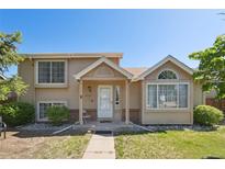 Charming two-story home with a well-maintained front yard and welcoming entrance in a suburban neighborhood at 21111 E 43Rd Ave, Denver, CO 80249