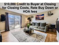 Cozy living room with a sliding glass door and view of the backyard at 8051 Wolff St # I, Westminster, CO 80031