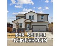 Charming two-story home with a modern design, a two-car garage and professionally maintained landscaping at 8852 Ventura St, Commerce City, CO 80022