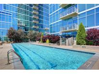 Beautiful outdoor pool at condo complex with stunning views of the building and landscaping at 1700 Bassett St # 2117, Denver, CO 80202