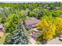 Overhead view of home featuring mature trees and well manicured front yard landscaping with fresh green grass at 1579 W Costilla Pl, Littleton, CO 80120