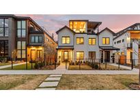 Modern home with a well-manicured front yard and a charming black fence at 354 Milwaukee St, Denver, CO 80206