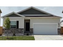 Charming single-Gathering home with a two-car garage and well-manicured lawn at 2164 Alyssa St, Fort Lupton, CO 80621