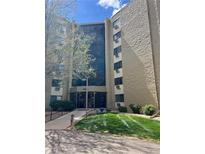 Apartment building with large front windows and well-maintained lawn at 13601 E Marina Dr # 305, Aurora, CO 80014