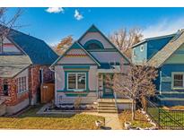 Charming home featuring unique architectural details and colorful accents, complemented by a well-maintained front yard at 3613 Julian St, Denver, CO 80211