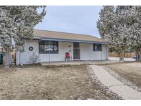 Charming single-story home with a welcoming porch and drought-resistant landscaping at 2391 Kingston St, Aurora, CO 80010