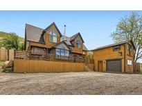 Unique multi-level exterior with wood and stone details at 220 Wark Ave, Berthoud, CO 80513