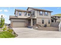 Charming two-story home with a two car garage, covered porch and neutral colored exterior paint at 138 Lullaby Ln, Castle Rock, CO 80109
