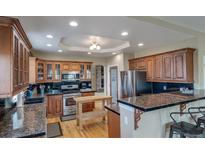 Beautiful kitchen with stainless steel appliances, wood cabinets, and granite countertops at 40900 Red Fox Cir, Elizabeth, CO 80107