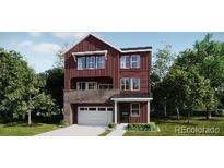 A charming two-story home with a brick and siding facade, plus a white garage door at 8847 Waterleaf Ln, Littleton, CO 80125