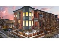 Attractive brick three-story home with landscaping at 2946 Central Park Blvd, Denver, CO 80238