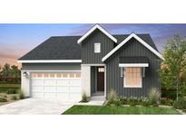 Charming single-Gathering home featuring stone accents, a two-car garage, and a well-manicured lawn at 17055 W 92Nd Loop, Arvada, CO 80007