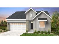 Charming single-Gathering home featuring vertical siding and a two-car garage, blending modern design with comfort at 17055 W 92Nd Loop, Arvada, CO 80007
