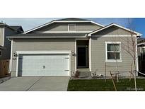Charming one-story home featuring a two-car garage and inviting curb appeal in a residential neighborhood at 819 Sunflower Dr, Brighton, CO 80601
