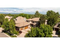 Expansive home situated among lush trees; featuring a spacious yard and spectacular mountain views at 2535 W 115Th Dr, Westminster, CO 80234