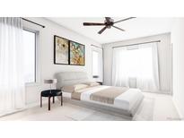 Bright bedroom with a large bed, neutral decor, and natural light from large windows at 81 N Meade St, Denver, CO 80219