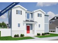 Charming two-story home featuring a bright red front door, white siding, and an inviting front porch at 22394 E 39Th Ave, Aurora, CO 80019