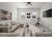 Cozy living room with plush seating, decorative accents, and neutral tones for a relaxing atmosphere at 12547 Lake View St, Longmont, CO 80504
