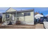 Charming single-Gathering home featuring a well-maintained lawn and private driveway with a detached garage at 3607 W 80Th Ave, Westminster, CO 80030