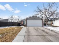 Ranch style home with attached garage, landscaped yard, and modern finishes at 11203 Dexter St, Thornton, CO 80233