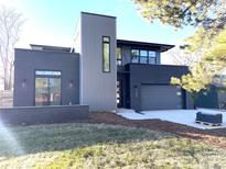 Modern two-story home with gray exterior and attached garage at 3289 S Eudora St, Denver, CO 80222