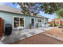 Cozy backyard patio with outdoor dining area, perfect for entertaining and enjoying outdoor living at 247 Tipple Pkwy, Frederick, CO 80530