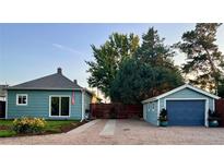 Charming home featuring a detached garage, well-maintained landscaping, and inviting curb appeal at 247 Tipple Pkwy, Frederick, CO 80530