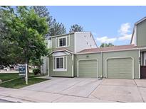 Charming two-story home with an attached two car garage, neutral exterior, and well-manicured lawn at 8997 W 88Th Ave, Westminster, CO 80021