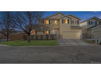 Charming two-story home with a well-maintained lawn and attached garage, perfect for suburban living at 10121 Wyandott Cir, Thornton, CO 80260