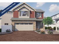 Charming two-story home with a brick driveway and a two-car garage in a Gathering-friendly neighborhood at 1182 Sugarloaf Ln, Erie, CO 80516
