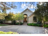 Charming home exterior featuring a beautiful stone pathway and meticulously landscaped front yard at 60 Glenalla Pl, Castle Rock, CO 80108