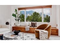 Bright living room featuring a comfortable reading nook with mountain views at 1312 Sandstone Ct, Boulder, CO 80305