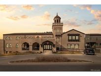 Stunning building with unique architectural design, intricate detailing, and inviting entrance under a beautiful sky at 4625 W 50Th Ave # 110, Denver, CO 80212
