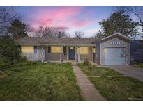 Charming single-story home with a well-manicured lawn and attached one-car garage at 3353 S Glencoe St, Denver, CO 80222