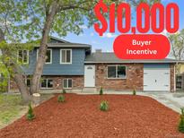 Newly renovated ranch home with landscaped yard and two-car garage at 4562 S Gar Way, Littleton, CO 80123