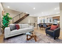 Bright and modern living space with contemporary furniture, open to dining and kitchen areas at 4469 Tennyson St # 15, Denver, CO 80212