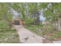 View of the driveway leading up to the house at 1645 Tamarac St, Denver, CO 80220