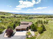 Stunning home with lush landscaping, three-car garage and mountain views at 10370 Grande Vista Ct, Lone Tree, CO 80124