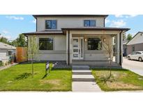 Charming two-story home featuring a manicured lawn and modern architectural design at 3226 W Dakota Ave, Denver, CO 80219