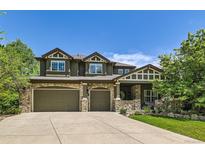 Charming two-story home with a three-car garage and a beautifully landscaped front yard at 14118 Whitney Cir, Broomfield, CO 80023