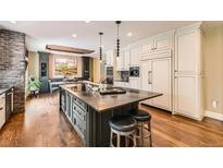 Spacious kitchen with granite island, stainless appliances, and adjacent dining area at 14118 Whitney Cir, Broomfield, CO 80023
