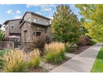 Inviting exterior showcases stone accents and manicured landscaping at 2429 S Orchard St, Lakewood, CO 80228