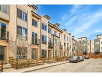 Modern townhouses with a shared courtyard and parking at 1927 Eaton St, Lakewood, CO 80214