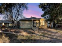 Charming single-story home featuring a well-maintained front yard and inviting entrance at 7877 York St # 1, Denver, CO 80229